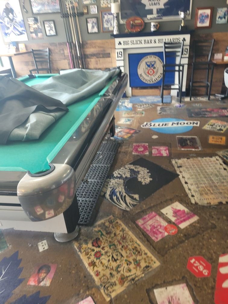 Dufferin Challenger 4.5x9 pool table, full view in a bar setting